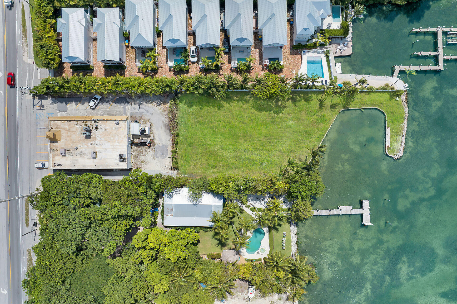 81908 Overseas Highway Islamorada, FL 33036 - Photo 2 of 23 an aerial view of a house with outdoor space swimming pool and lake view