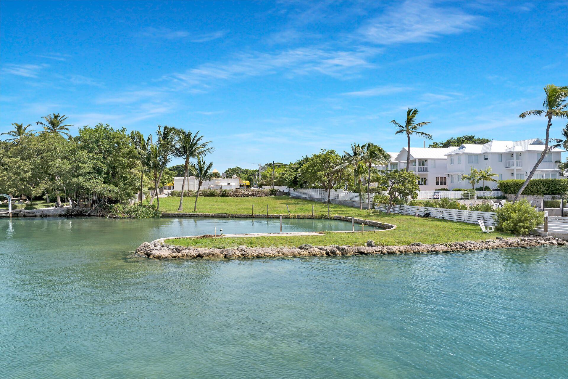 81908 Overseas Highway Islamorada, FL 33036 - Photo 7 of 23 a view of a lake with houses in the background