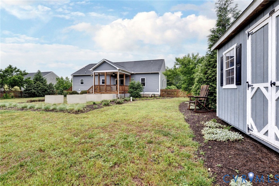 8904 Rock Cedar Road New Kent, VA 23124 - Photo 29 of 37 a front view of a house with garden