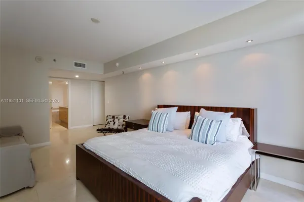 a bed room with a bed and a couch