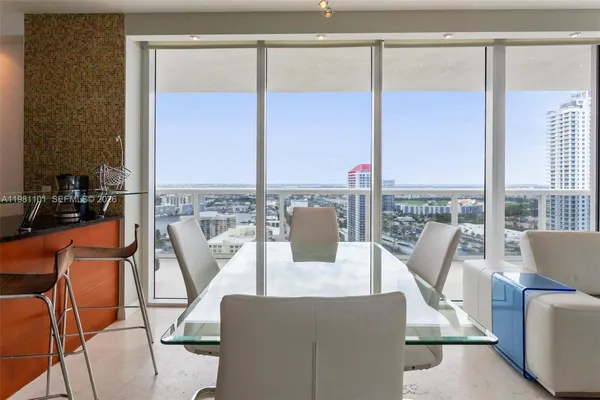a view of a dining room with furniture window and outside view