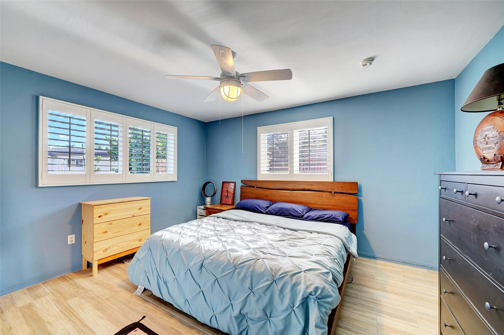 3314 West Park Road Hollywood, FL 33021 - Photo 18 of 25 a bedroom with a bed and wooden floor