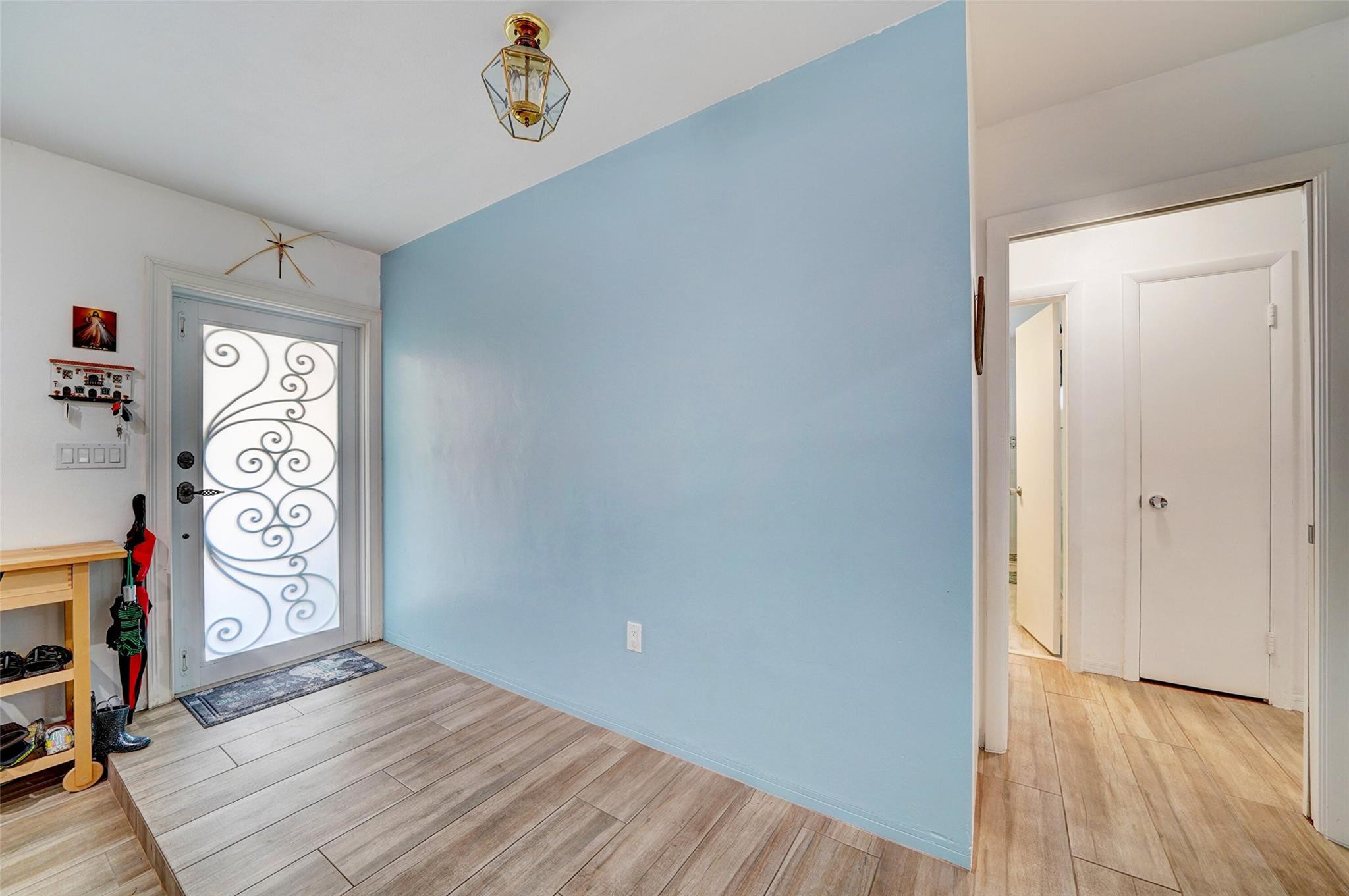3314 West Park Road Hollywood, FL 33021 - Photo 5 of 25 a view of a hallway with wooden floor