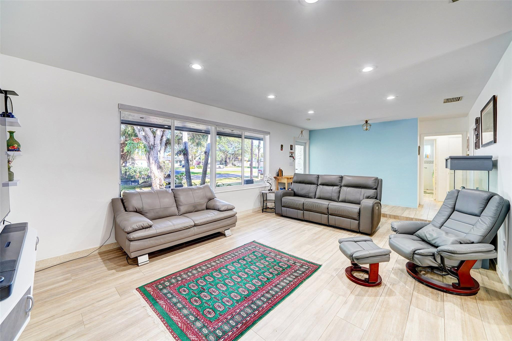 3314 West Park Road Hollywood, FL 33021 - Photo 6 of 25 a living room with furniture a rug and a table