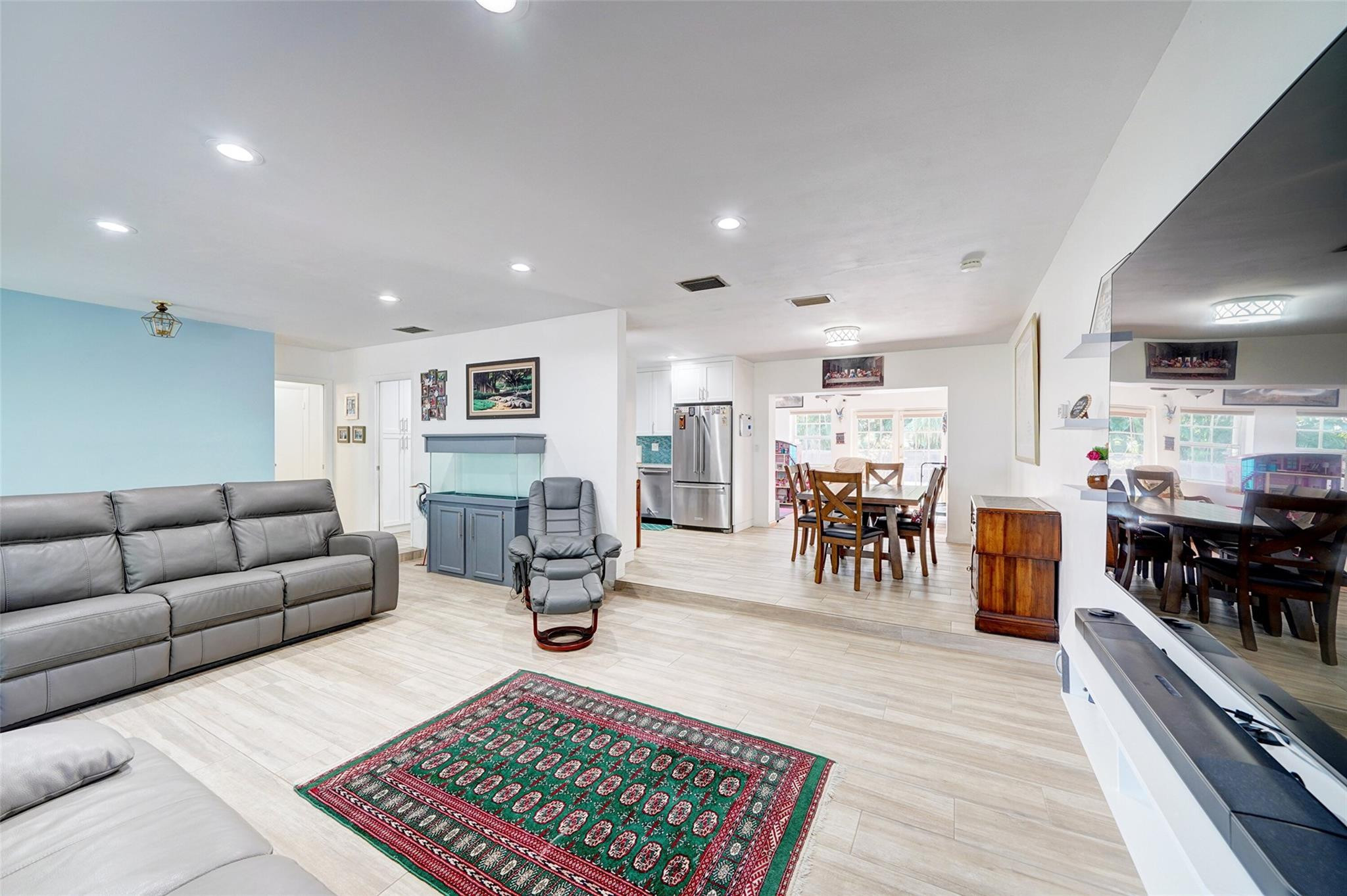 3314 West Park Road Hollywood, FL 33021 - Photo 7 of 25 a living room with furniture and a table