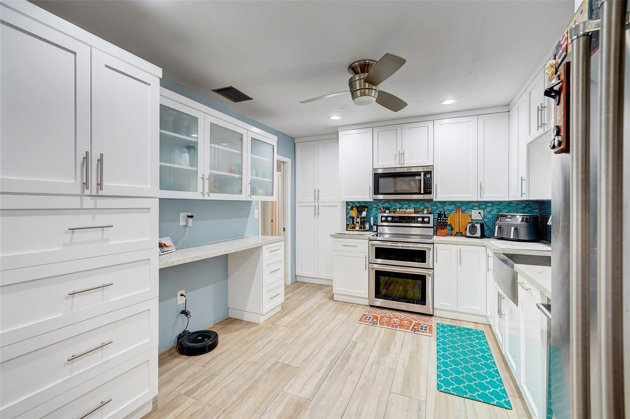 3314 West Park Road Hollywood, FL 33021 - Photo 9 of 25 a kitchen with granite countertop stainless steel appliances and wooden floor