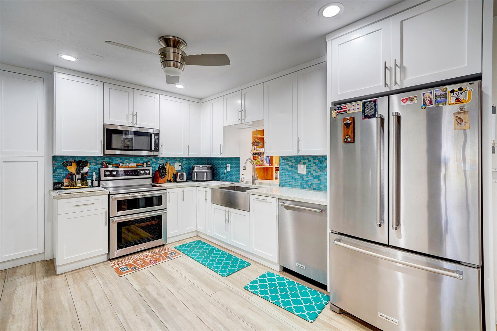 3314 West Park Road Hollywood, FL 33021 - Photo 10 of 25 a kitchen with granite countertop a refrigerator oven a sink and dishwasher