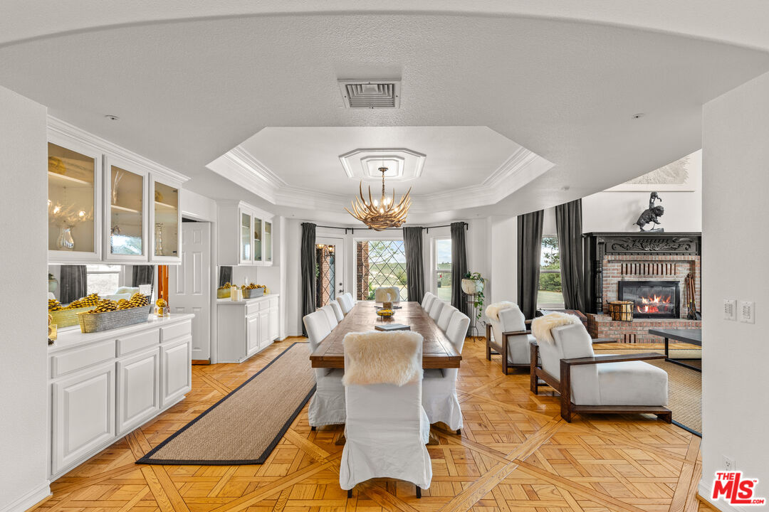 28765 Pine Canyon Road Lake Hughes, CA 93532 - Photo 17 of 58 a living room with patio furniture and a chandelier