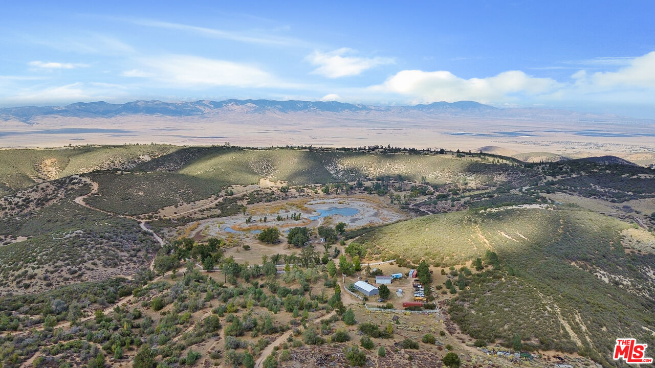 28765 Pine Canyon Road Lake Hughes, CA 93532 - Photo 2 of 58 a view of a lake with a mountain