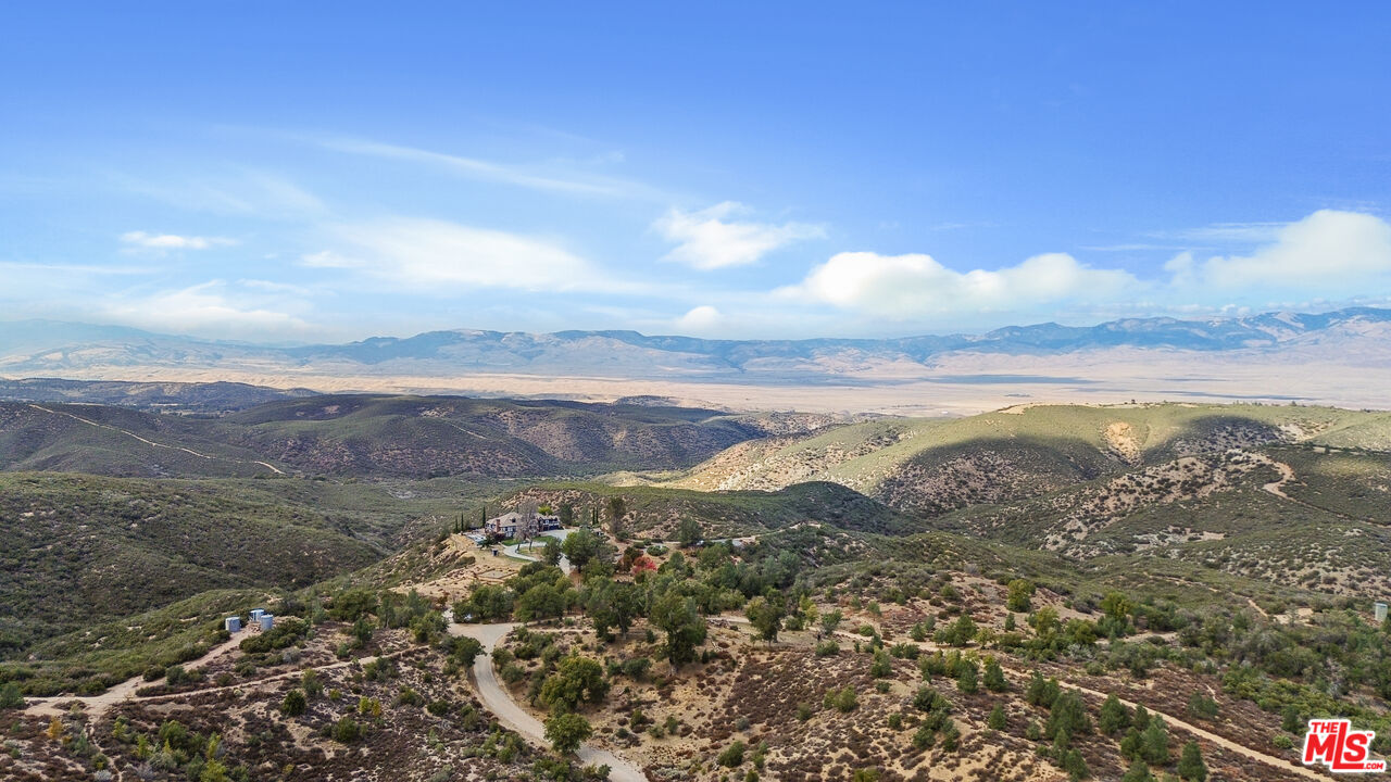 28765 Pine Canyon Road Lake Hughes, CA 93532 - Photo 4 of 58 a view of a city with mountains in the background