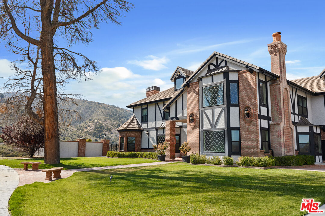 28765 Pine Canyon Road Lake Hughes, CA 93532 - Photo 42 of 58 a view of a building with a yard