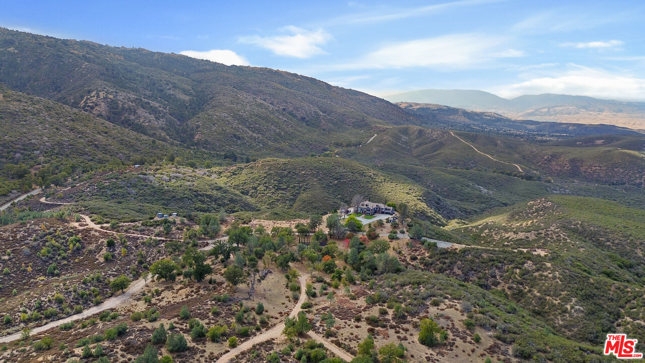 28765 Pine Canyon Road Lake Hughes, CA 93532 - Photo 58 of 58 a view of a house with a mountain in the background