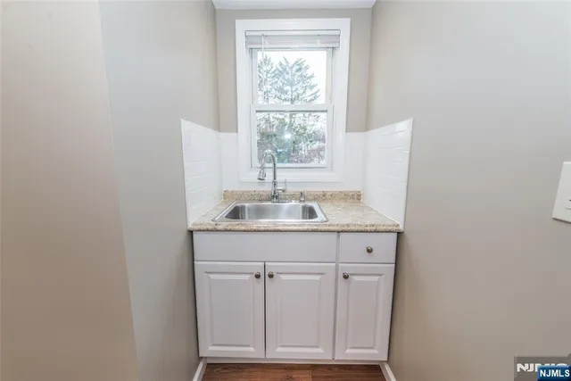 a bathroom with a sink and a window