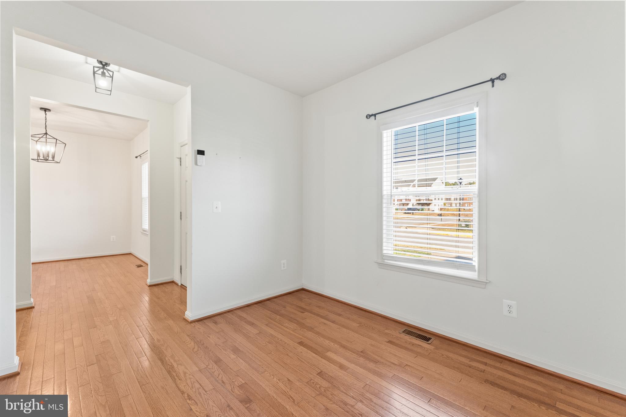 18350 Congressional Circle Ruther Glen, VA 22546 - Photo 11 of 55 an empty room with wooden floor and a window