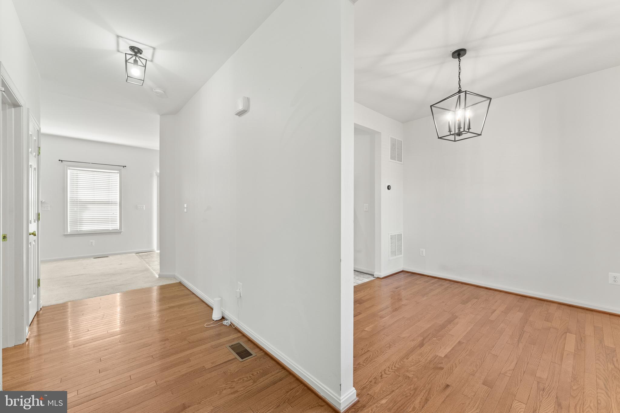 18350 Congressional Circle Ruther Glen, VA 22546 - Photo 12 of 55 a view of an empty room with wooden floor and a window