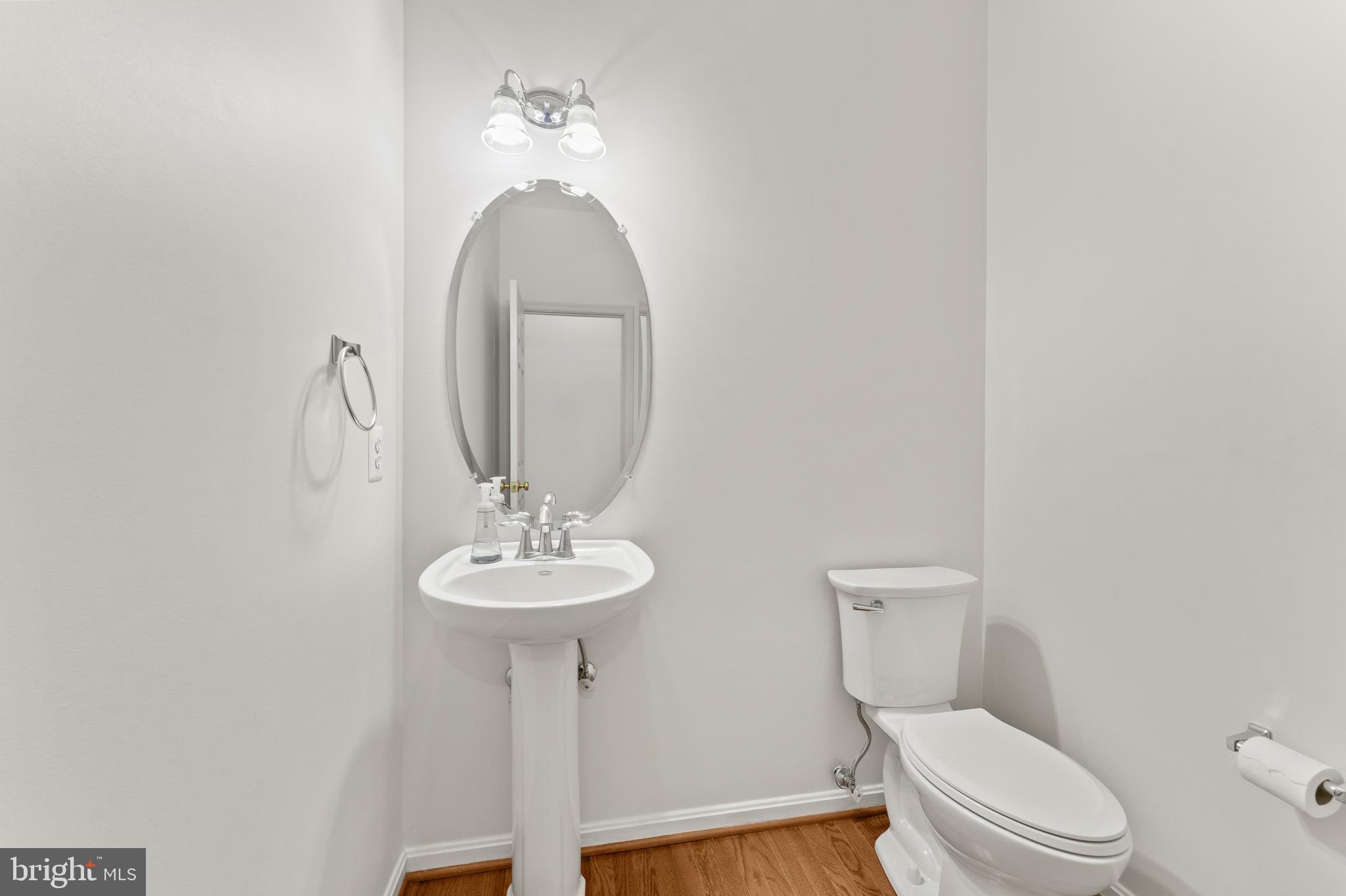 18350 Congressional Circle Ruther Glen, VA 22546 - Photo 13 of 55 a bathroom with a toilet a sink and mirror