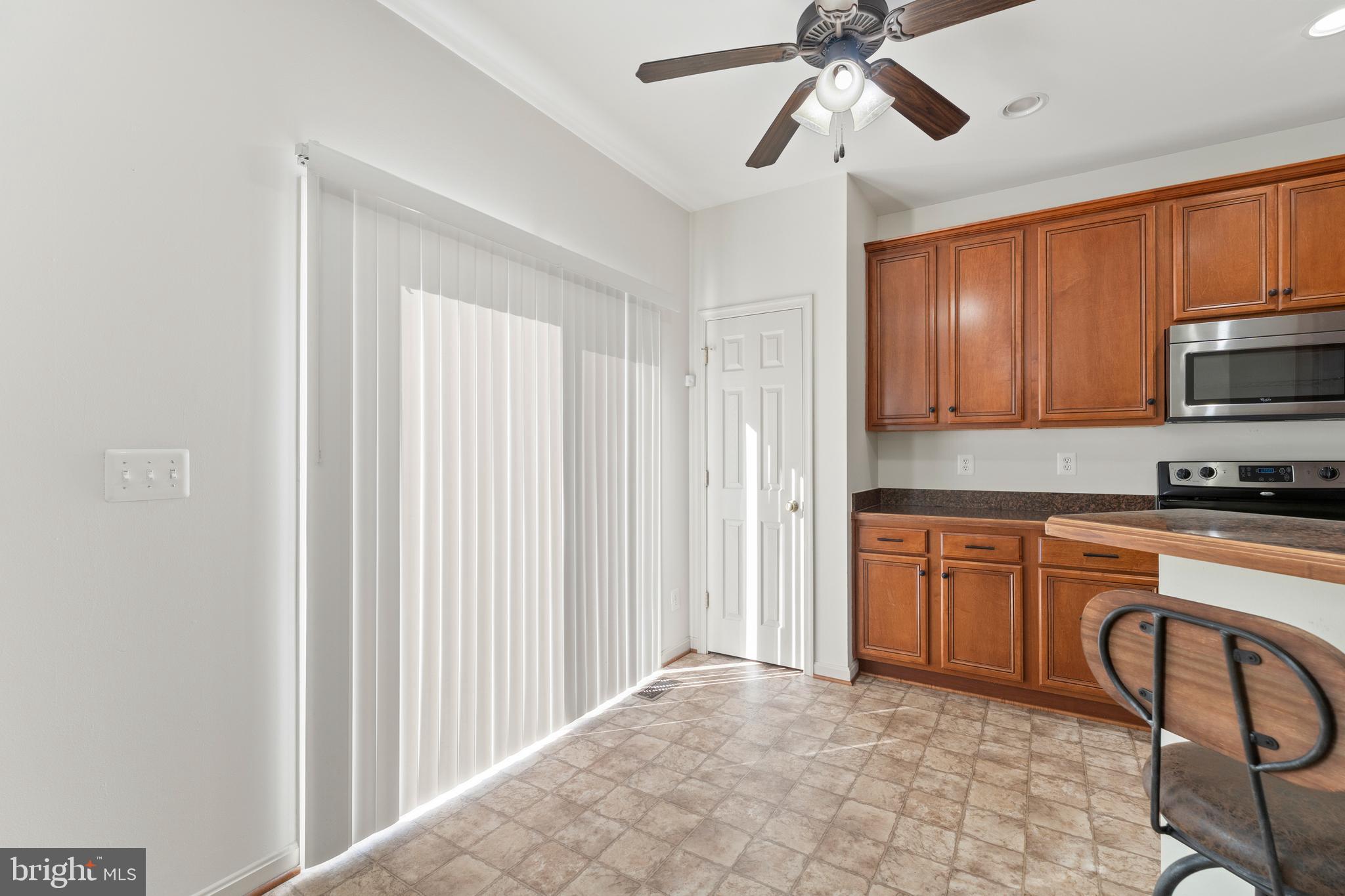 18350 Congressional Circle Ruther Glen, VA 22546 - Photo 23 of 55 a kitchen with stainless steel appliances granite countertop a refrigerator and a sink