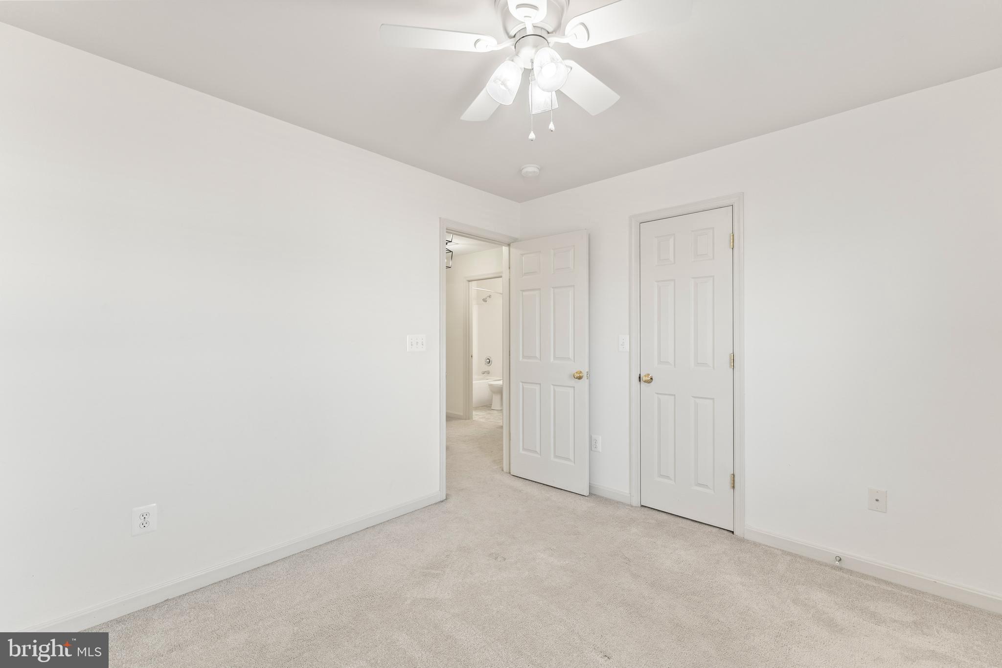 18350 Congressional Circle Ruther Glen, VA 22546 - Photo 29 of 55 an empty room with a chandelier fan and closet area