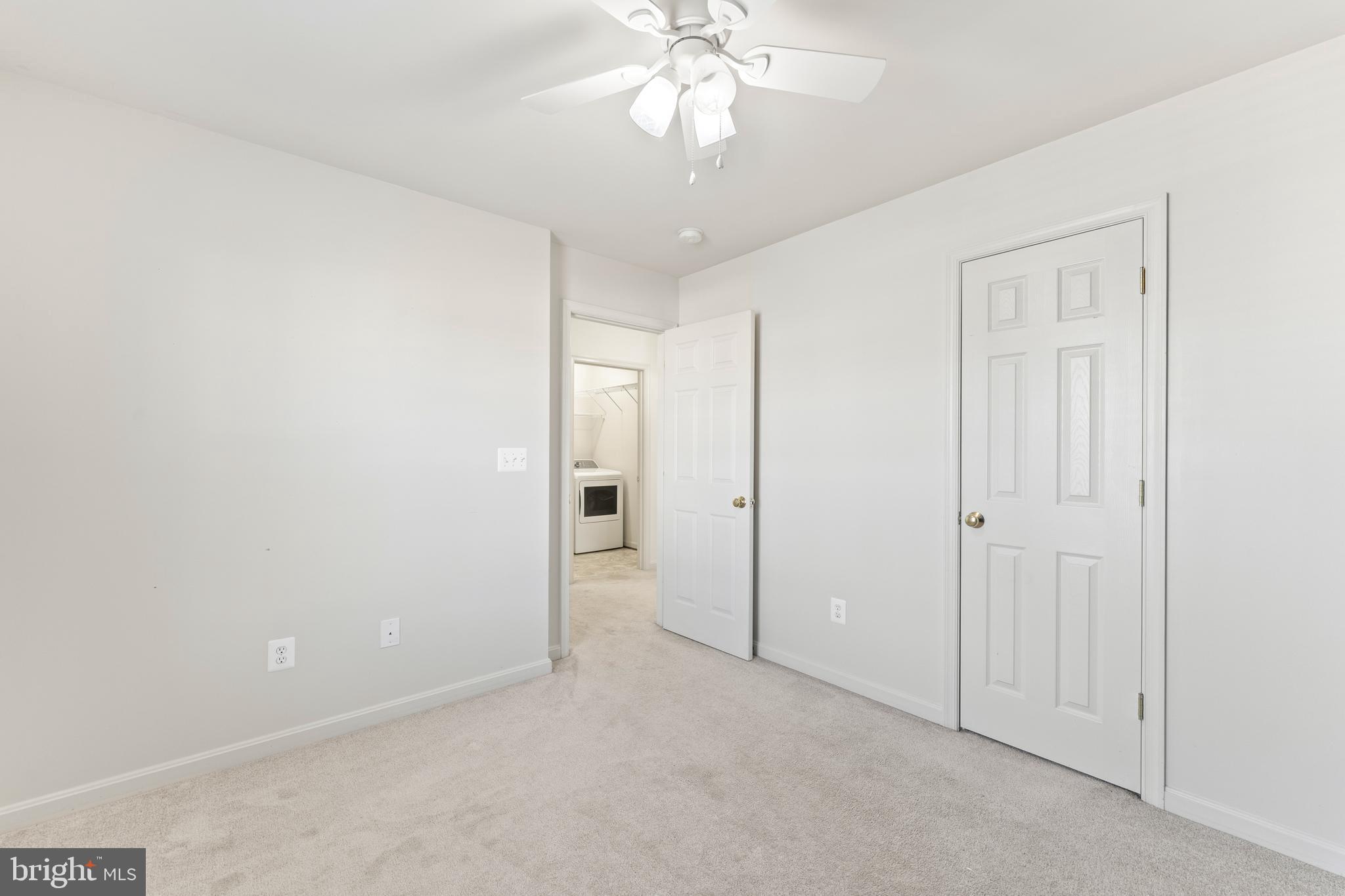 18350 Congressional Circle Ruther Glen, VA 22546 - Photo 31 of 55 an empty room with chandelier fan and closet area