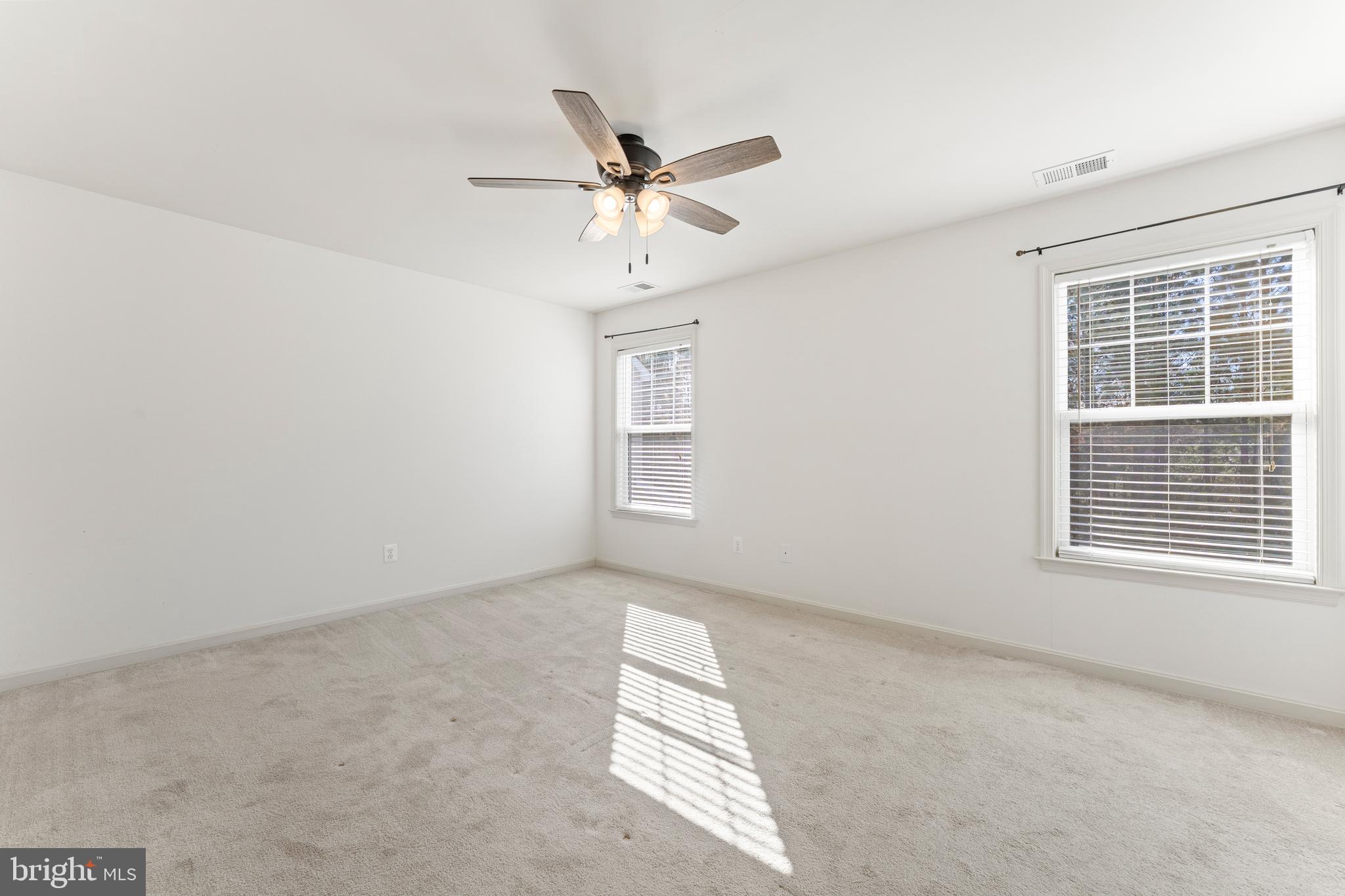 18350 Congressional Circle Ruther Glen, VA 22546 - Photo 34 of 55 an empty room with windows and fan