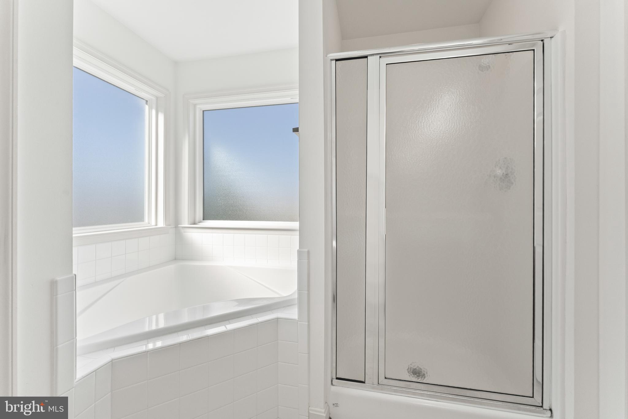 18350 Congressional Circle Ruther Glen, VA 22546 - Photo 38 of 55 a bathroom with a glass shower door