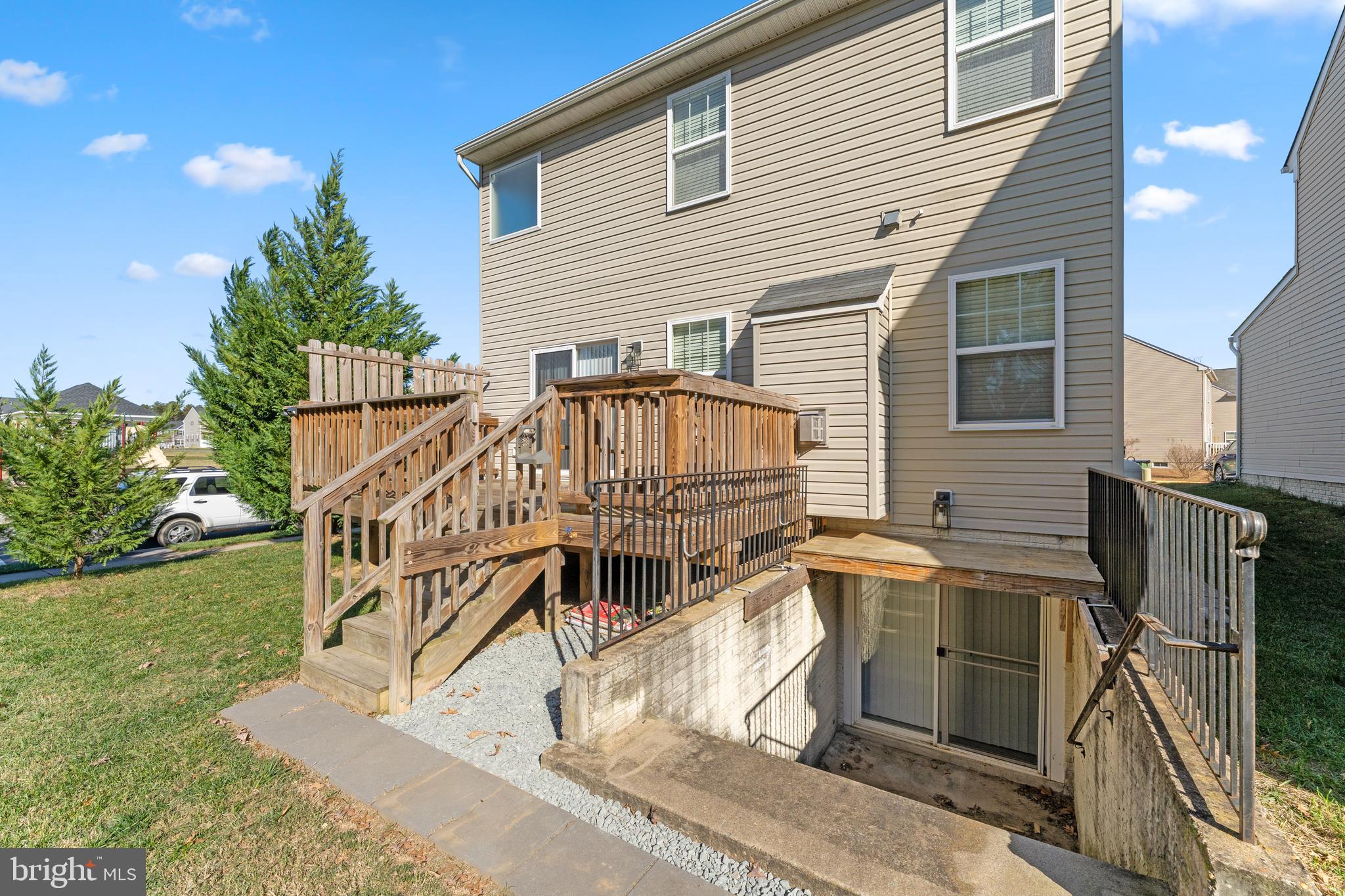 18350 Congressional Circle Ruther Glen, VA 22546 - Photo 6 of 55 a view of a house with backyard and deck