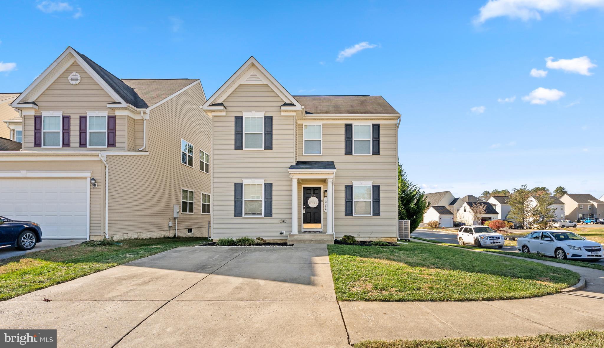 18350 Congressional Circle Ruther Glen, VA 22546 - Photo 8 of 55 a front view of a house with a yard