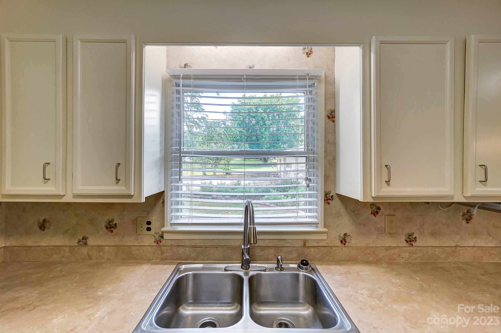 744 Ike Lynch Road Dallas, NC 28034 - Photo 14 of 47 a kitchen with a sink and cabinets