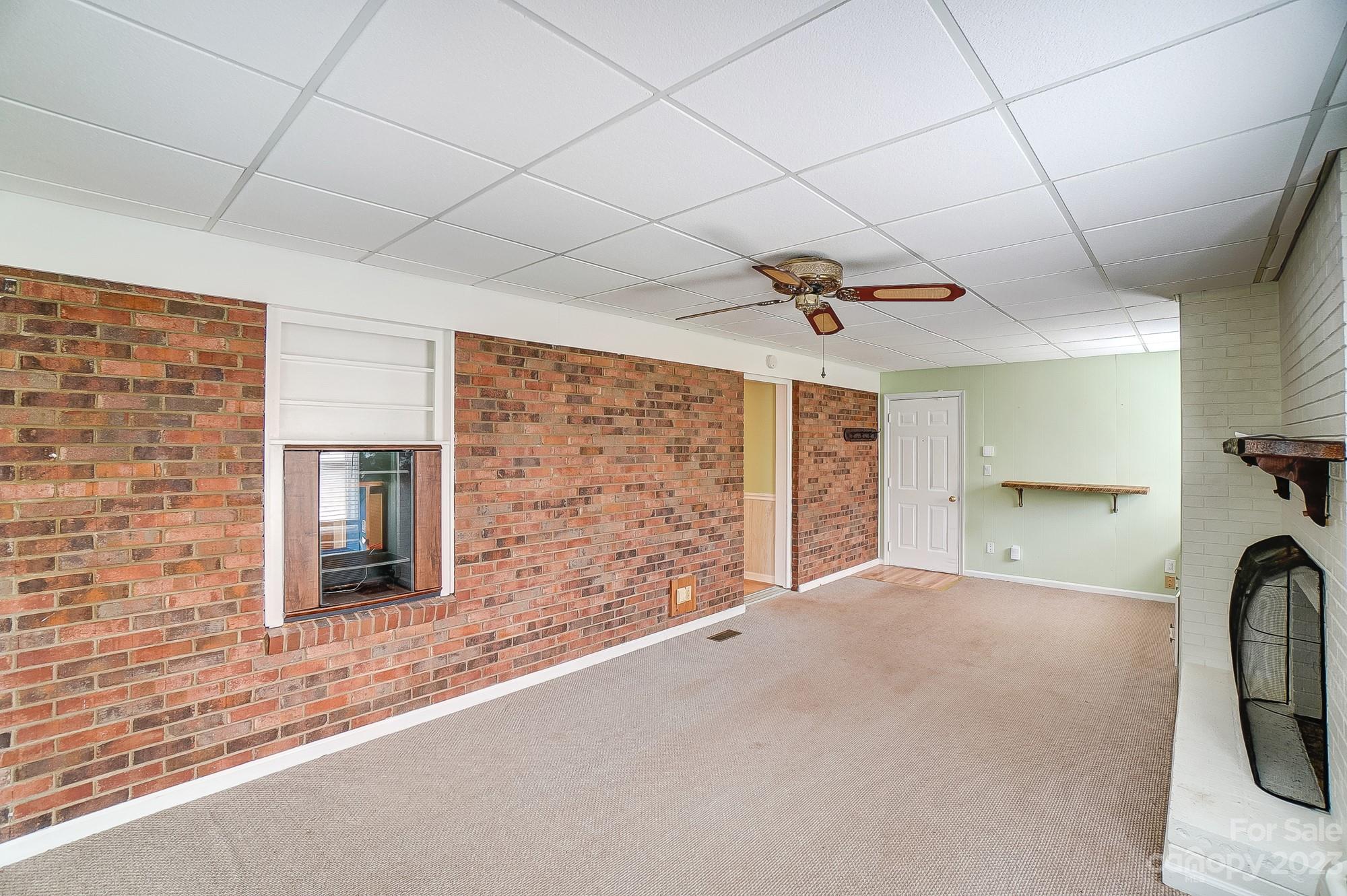 744 Ike Lynch Road Dallas, NC 28034 - Photo 18 of 47 a view of a livingroom with a fireplace