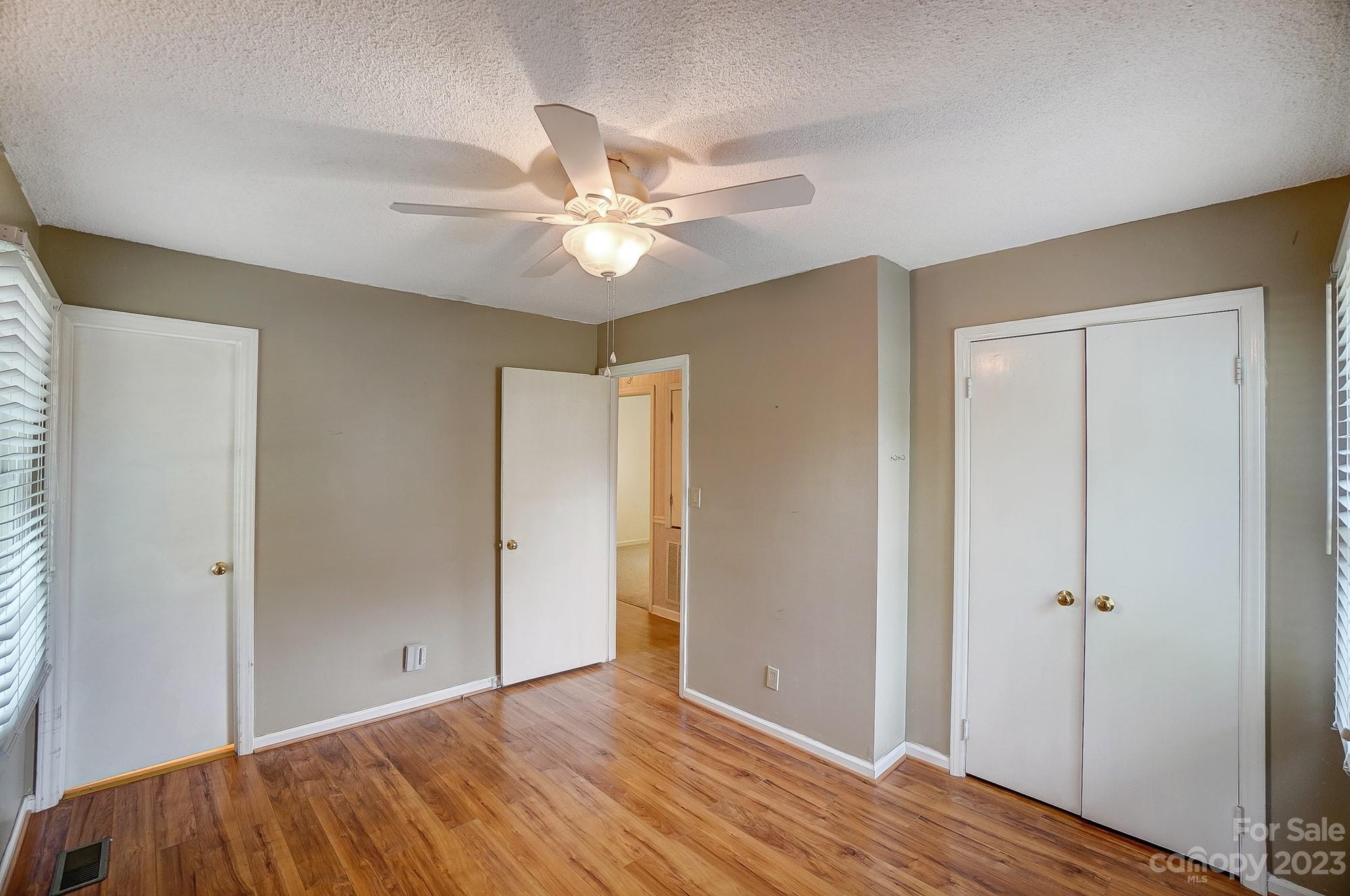 744 Ike Lynch Road Dallas, NC 28034 - Photo 24 of 47 a view of an empty room with wooden floor