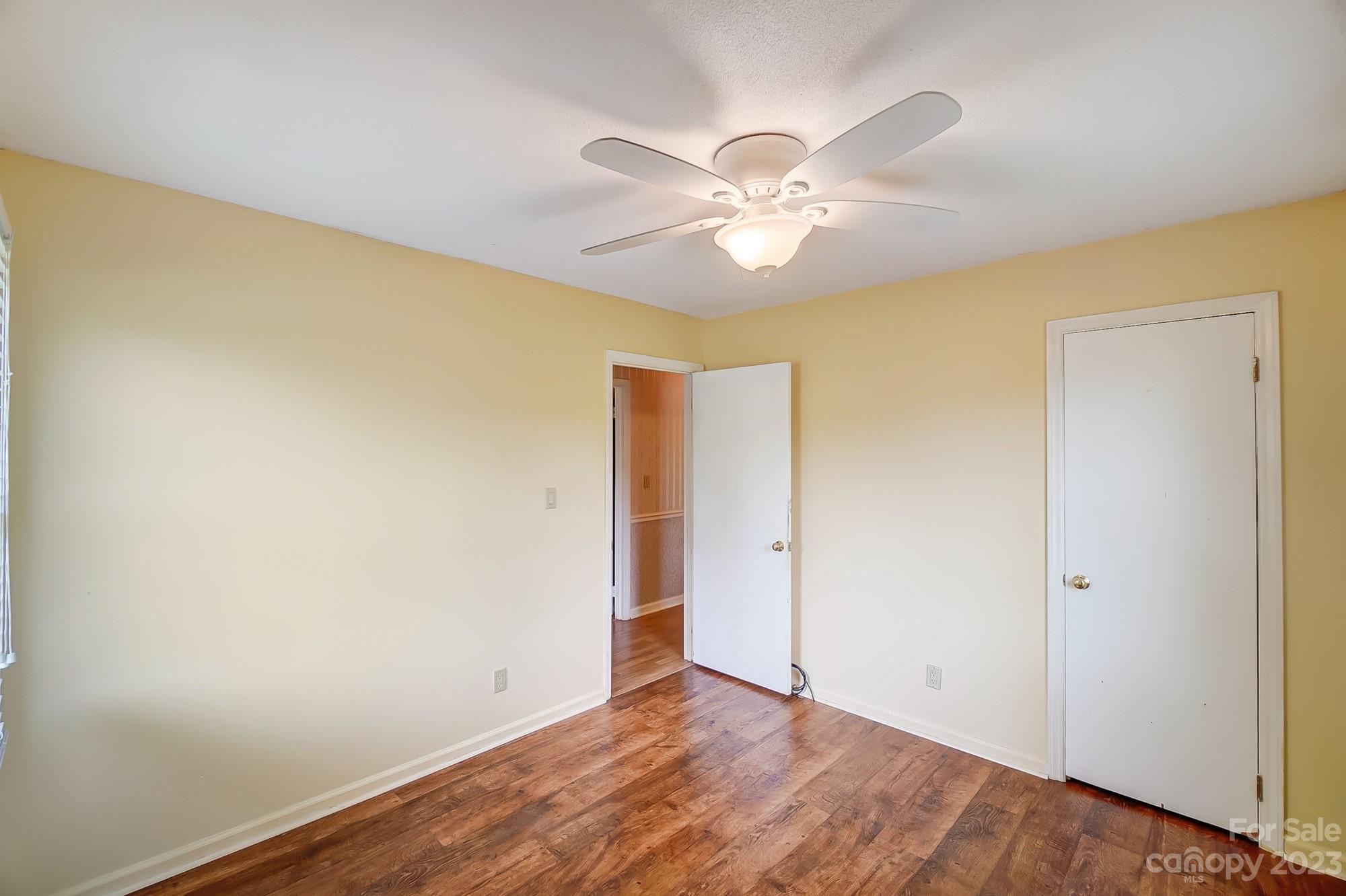 744 Ike Lynch Road Dallas, NC 28034 - Photo 29 of 47 a view of an empty room with wooden floor