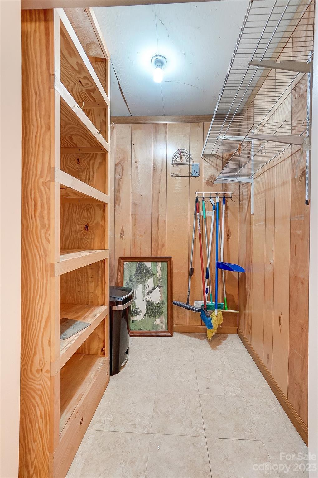 744 Ike Lynch Road Dallas, NC 28034 - Photo 34 of 47 a view of an empty room with shelves