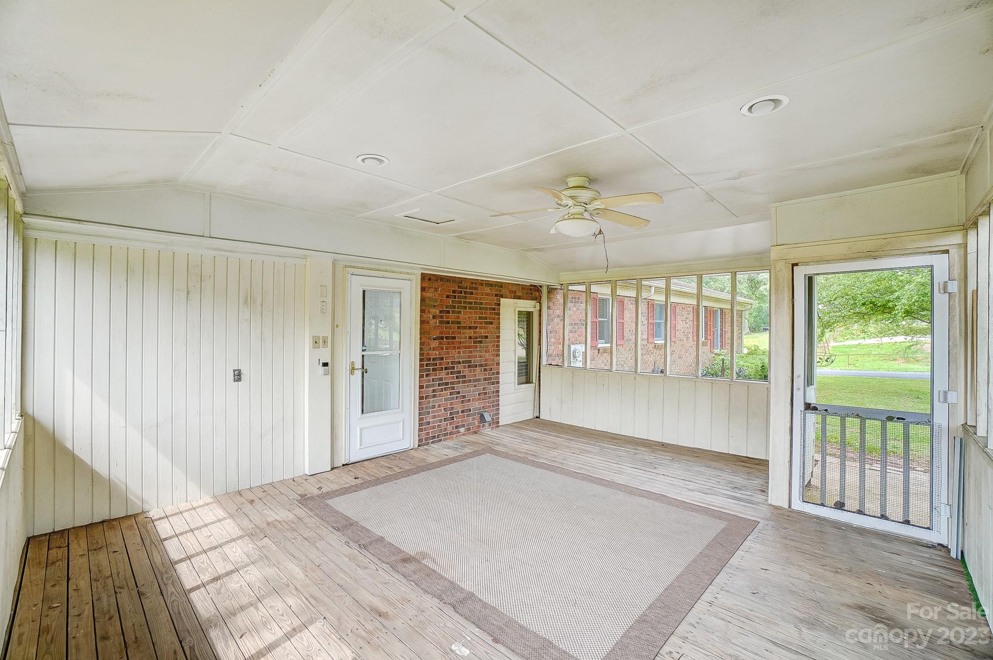 744 Ike Lynch Road Dallas, NC 28034 - Photo 35 of 47 a view of an empty room with wooden floor and a window