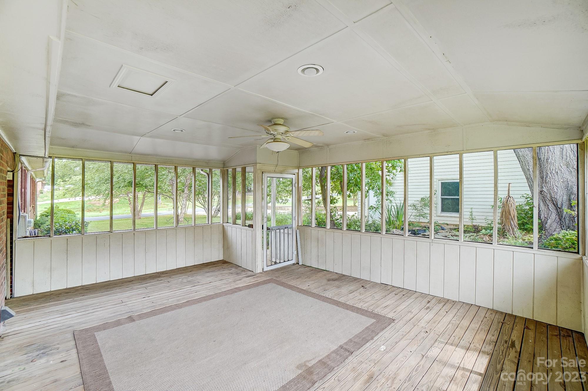 744 Ike Lynch Road Dallas, NC 28034 - Photo 36 of 47 an empty room with wooden floor and windows