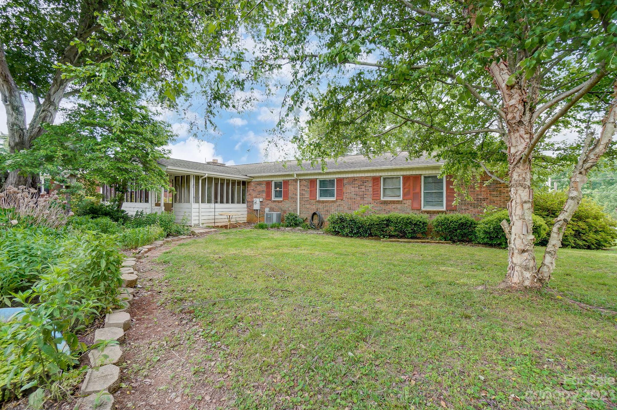 744 Ike Lynch Road Dallas, NC 28034 - Photo 46 of 47 a house view with a garden space