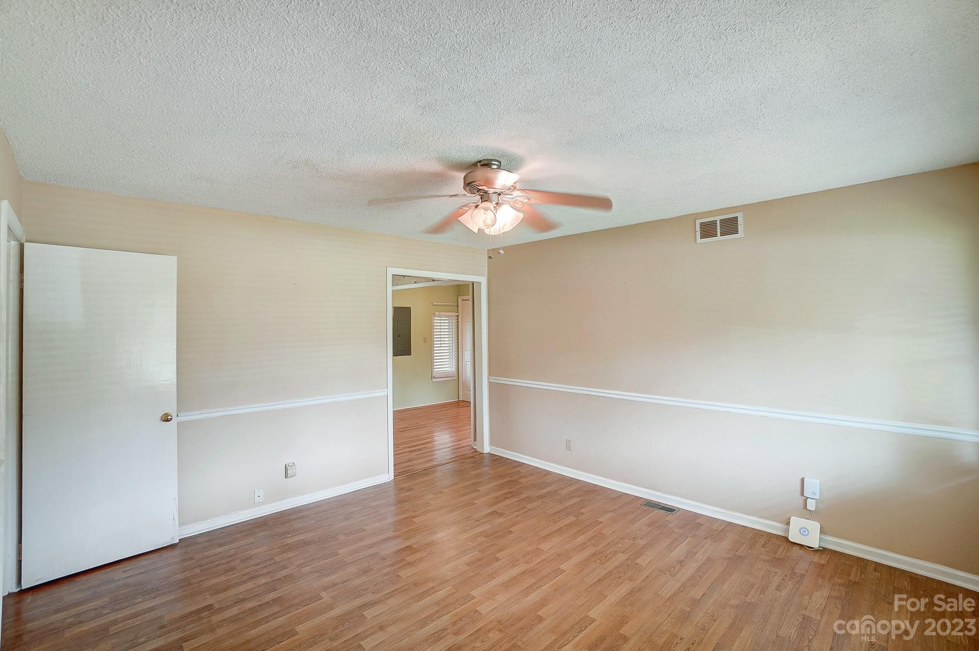 744 Ike Lynch Road Dallas, NC 28034 - Photo 7 of 47 wooden floor in an empty room with a window