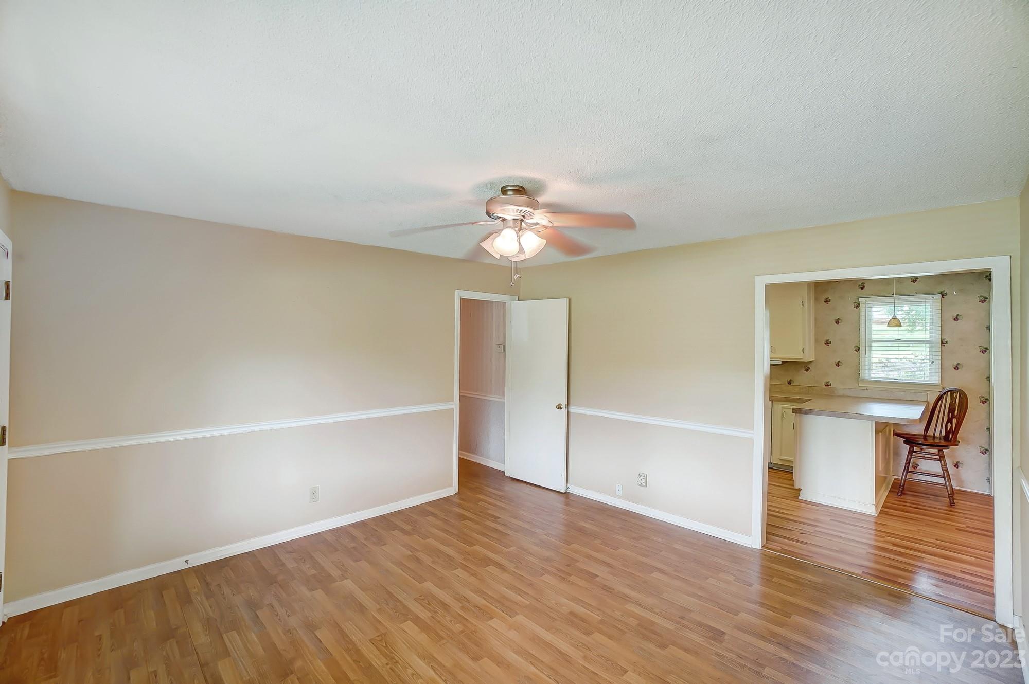 744 Ike Lynch Road Dallas, NC 28034 - Photo 8 of 47 a view of a livingroom with wooden floor