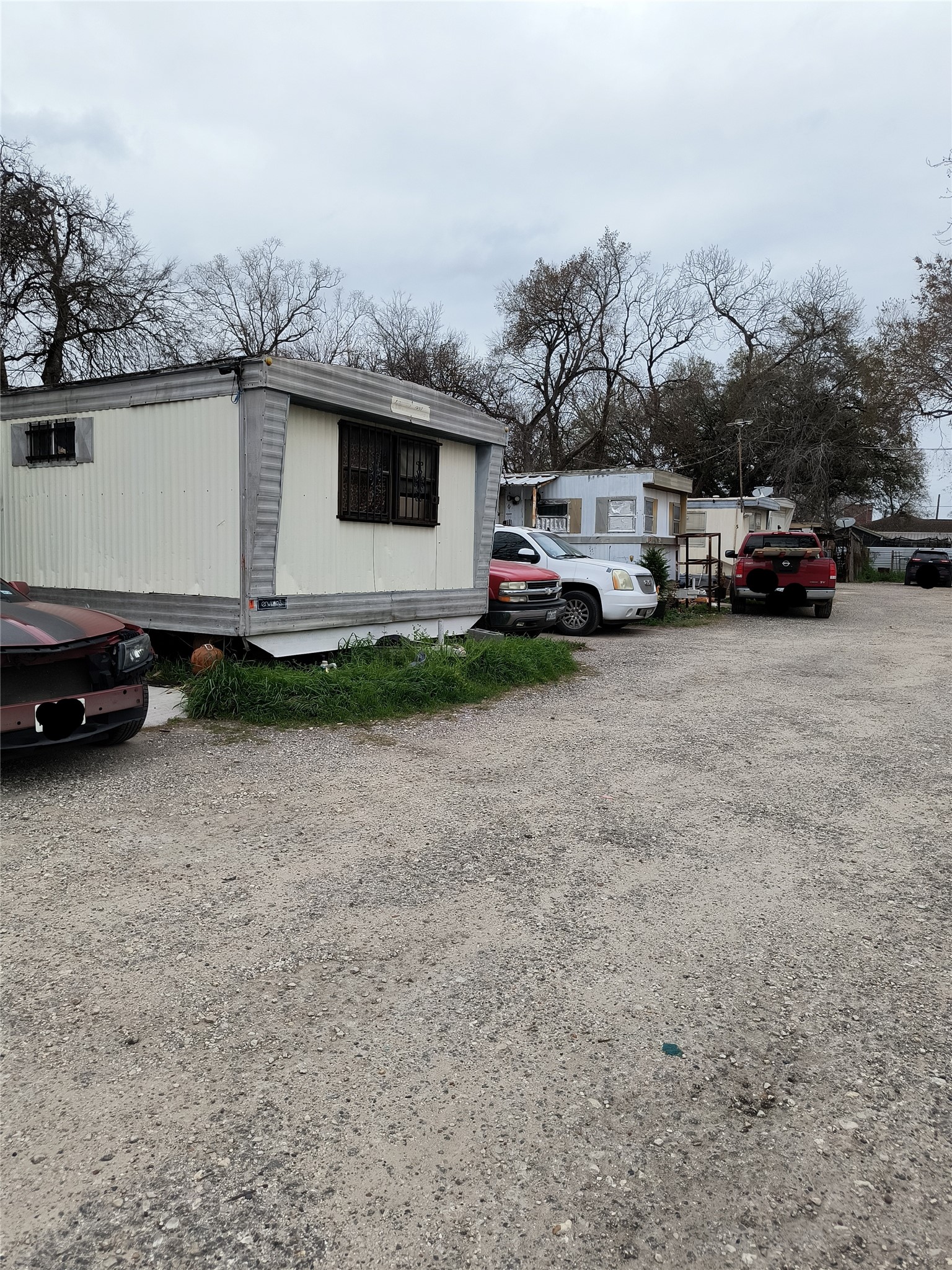 113 Busch Street, Unit 5 Houston, TX 77060 - Photo 4 of 6 a view of a cars park in front of a house