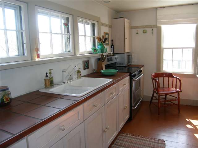 2701 West Forest Road Freeport, IL 61032 - Photo 5 of 9 a kitchen with a sink stove and cabinets