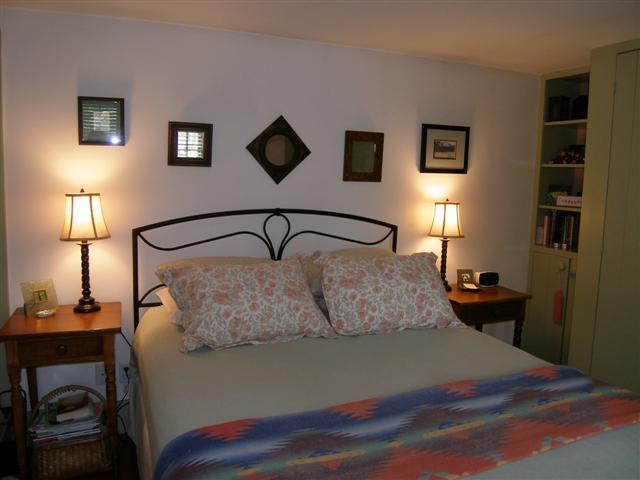 2701 West Forest Road Freeport, IL 61032 - Photo 6 of 9 a bedroom with a bed and wooden floor