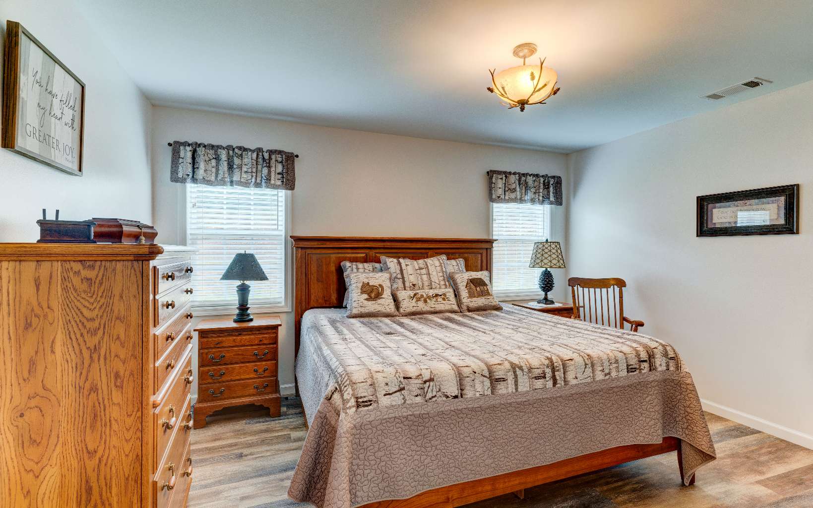 44 Linda Lane Blue Ridge, GA 30513 - Photo 13 of 32 a bedroom with a bed and a chandelier