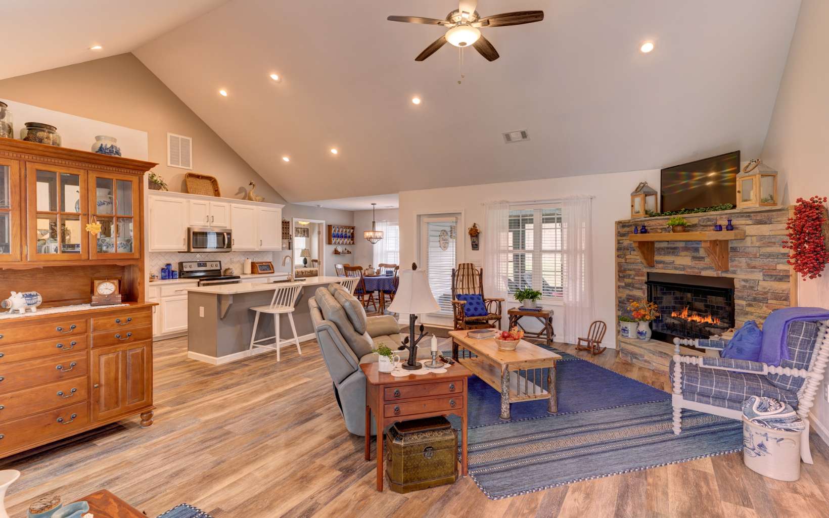 44 Linda Lane Blue Ridge, GA 30513 - Photo 2 of 32 a living room with furniture a flat screen tv and kitchen view