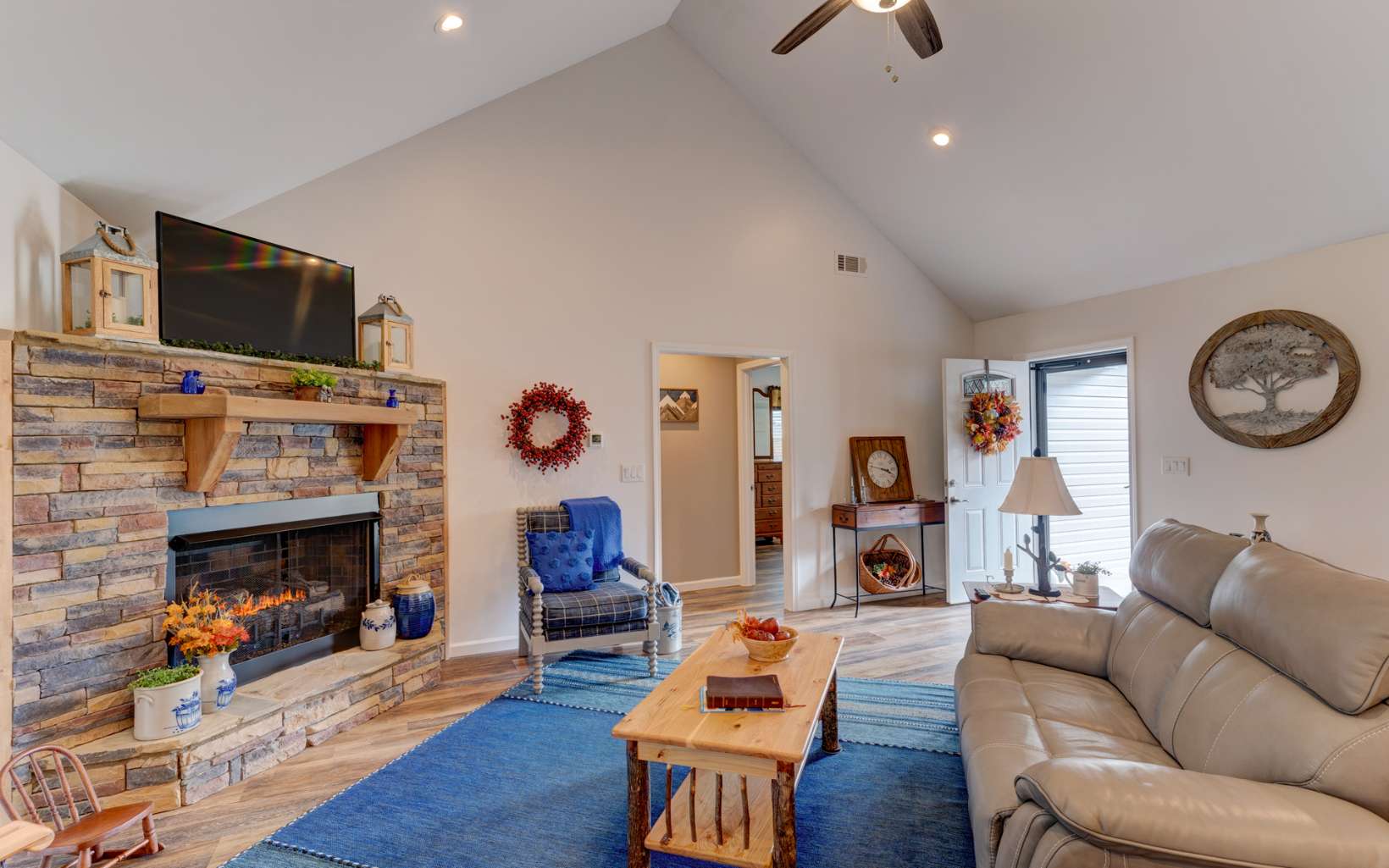 44 Linda Lane Blue Ridge, GA 30513 - Photo 10 of 32 a living room with furniture a flat screen tv and a fireplace