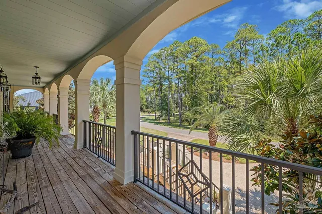 a dining room with furniture a chandelier and window