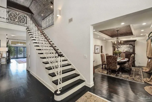 a kitchen with refrigerator and cabinets