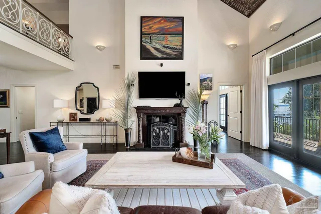 a bedroom with a large bed and a large window