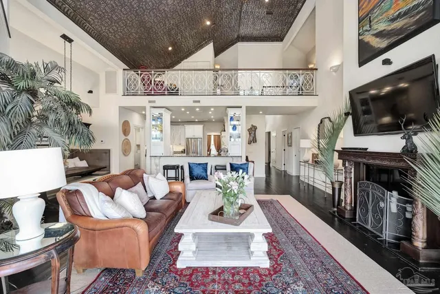 a bathroom with a granite countertop bathtub shower and mirror