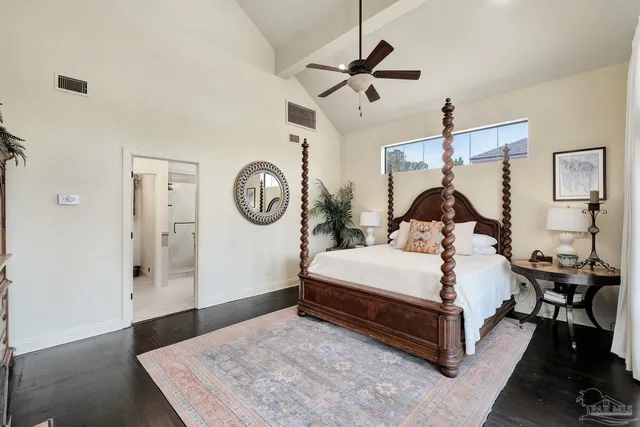 a bed room with a bed and a chandelier