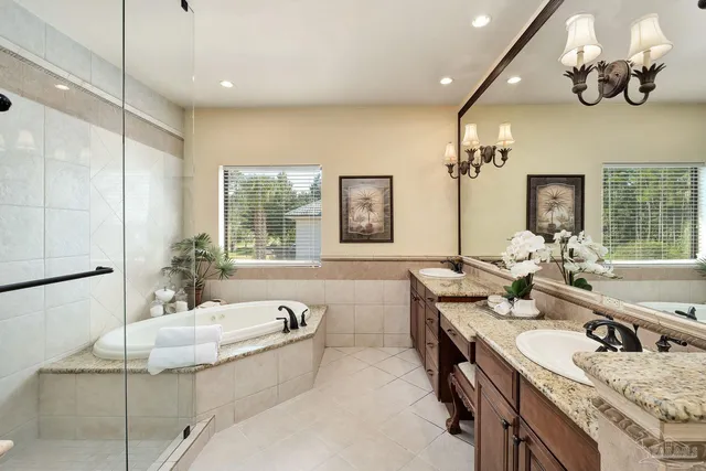 a kitchen with a sink appliances and cabinets