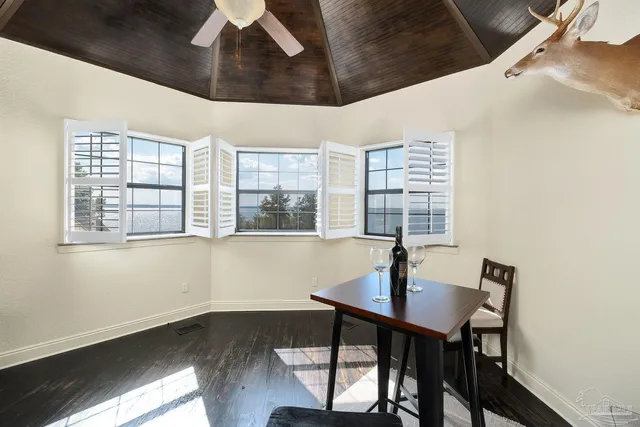 a view of a dining room with furniture window and outside view